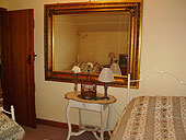 View of the twin bedroom with traditional country style furnishings