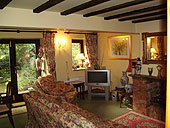  Views of the traditional beamed lounge with country style floral furnishings