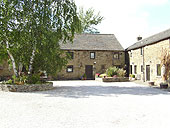 Showing the entrance doorway to the charming, traditional, prettily decorated 17th Century cottage